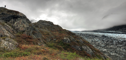 Humans appear small in this huge landscape