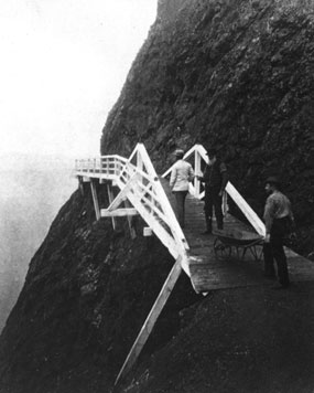 A photograph of the wooden walkway circa 1876, that was used before the construction of the tunnel on the Point Bonita trail.