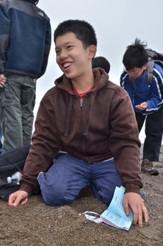 Student identifying the pebbles on Rodeo Beach