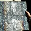 cleaned metal ceiling panel stripped of paint layers