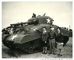 Women and man with tank, c. 1945