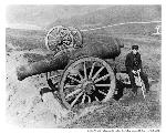 Man sitting on the Point Bonita Fog Cannon.