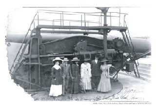 Gentlemen and ladies in front of gun at Battery Mendell, c 1908