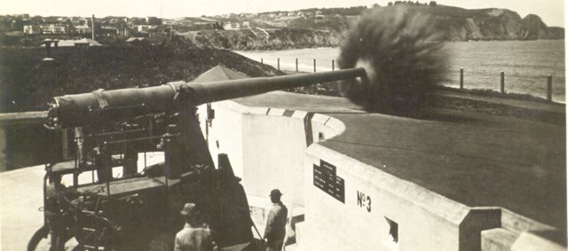 large concrete cannon firing near beach