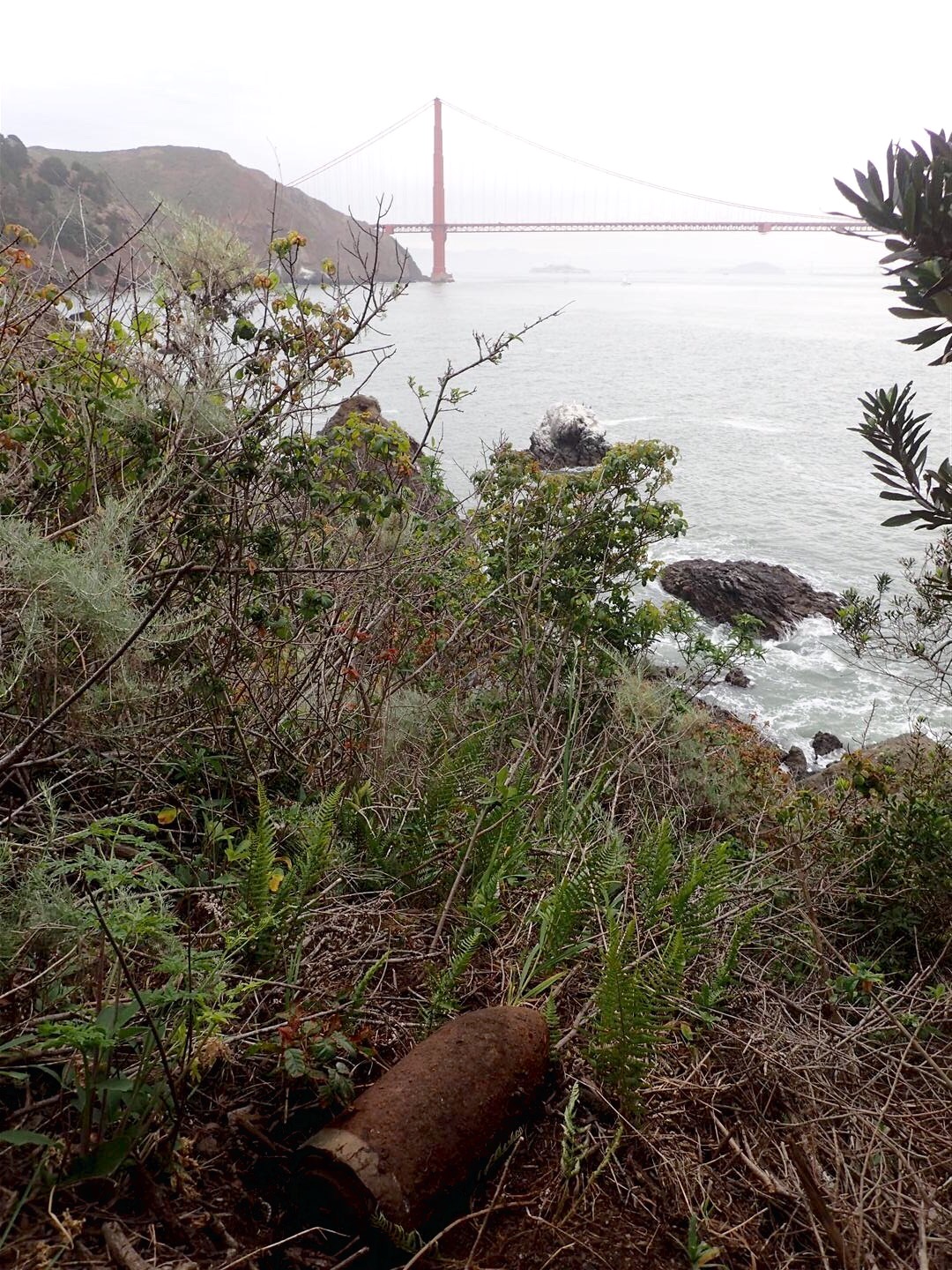 An 1880's projectile found in the Marin Headlands with the Golden Gate Bridge in the background.