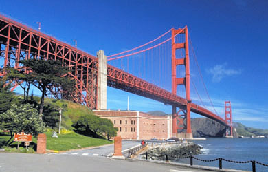A picture of Fort Point being dwarfed by the massive Golden Gate Bridge on a nice late summer day.
