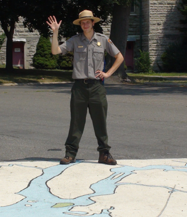A Ranger greets visitors at the Harbor Discovery Area