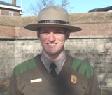 Ranger Brent standing in front of Fort Jay.
