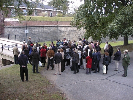 Park Rangers leading a tour through Fort Jay.