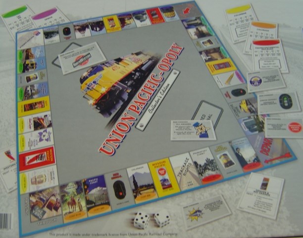 Union Pacific-opoly is a new twist on the original game of Monopoly, featuring a Golden Spike as one of the 6 tokens, and also features Promontory Summit in the traditional Baltic Ave. location, and Golden Spike in the Park Place location.  Union Pacifi-opoly is a new twist on the original game of Monopoly, featuring a Golden Spike as one of the 6 tokens, and also features Promontory Summit is the traditional Baltic Ave. location and Golden Spike in the Park Place location.  $24.95