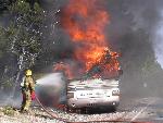 rangers work on motorhome fire