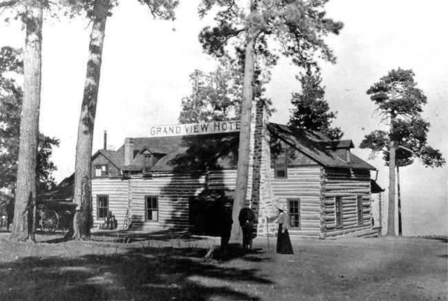 Hotel on rim of canyon, surrounded by ponderosa pines.