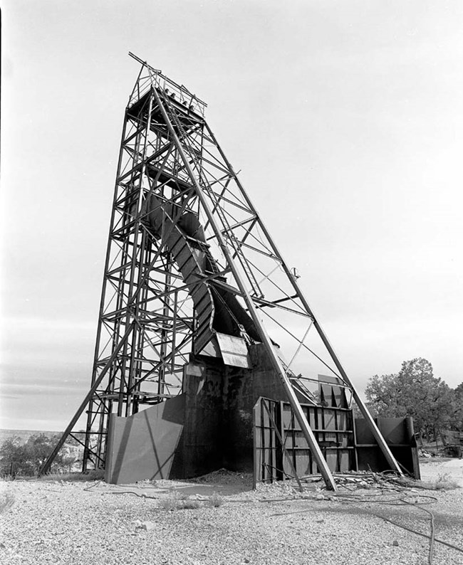 Headframe for mining: tower-like structure composed of wood.