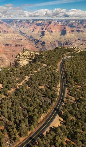 aerial view looking up Hermit Road with the canyon in the background.