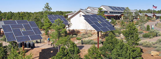The solar panels for the new photovoltaic system at the Grand Canyon Visitor Center are located both on the Visitor Center roof and on ground-mounted platforms adjacent to the Visitor Center complex.