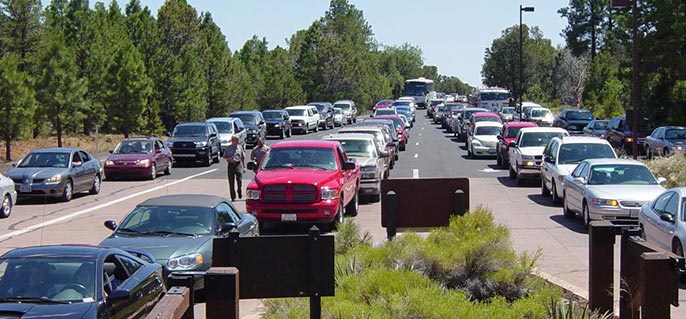 line of vehicles waiting to enter park during a busy holiday weekend