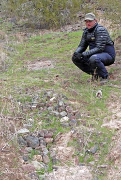 Examining a check dam built in the 1990's.