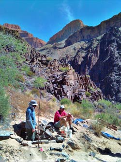 2 men working in archeological site in Monument Creek