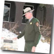 Howell looks at historic plaque in front of Verkamp's Visitor Center