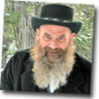 man with black hat and long beard