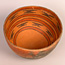 orange colored prehistoric bowl from the Grand Canyon.