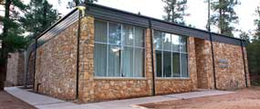 stone building with large glass windows