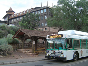 bus at bus stop below the El Tovar Hotel