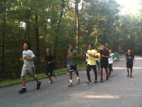 a picture of the Parkdale High School soccer team running in the park