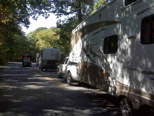 a picture of RV's arriving at the Campground fee booth