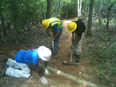 SCA students working on a waterbar in Greenbelt Park, Md.