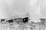 Image of the chuckwagon covered in a tent.