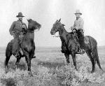 Two cowboys on the open range.