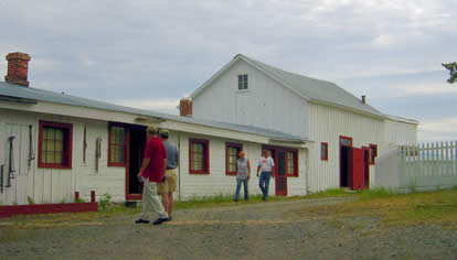 Visitors exploring bunkhouse row where the cowboys lived.