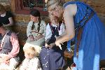 Kids Participate in Cornhusk Doll Workshop.