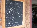The chefs chalkboard list of many kitchen deserts.