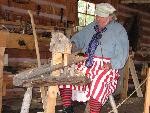 A craftsman creates paddles for the NWCo.