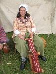Weaving a voyageur sash in the encampment