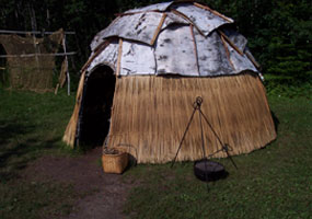 A summer lodge in the Monument's Ojibwe Village.