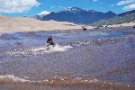 Girl in Medano Creek Wave