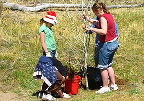 Children plant tree for Earth Day 2008