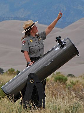 Ranger with telescope doing night sky program