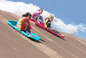 Kids Sledding on Sand October 2010