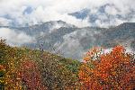 Mountain "smoke" rises above fall foliage