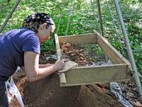 Melissa Crisp labels an artifact at a Cataloochee excavation.