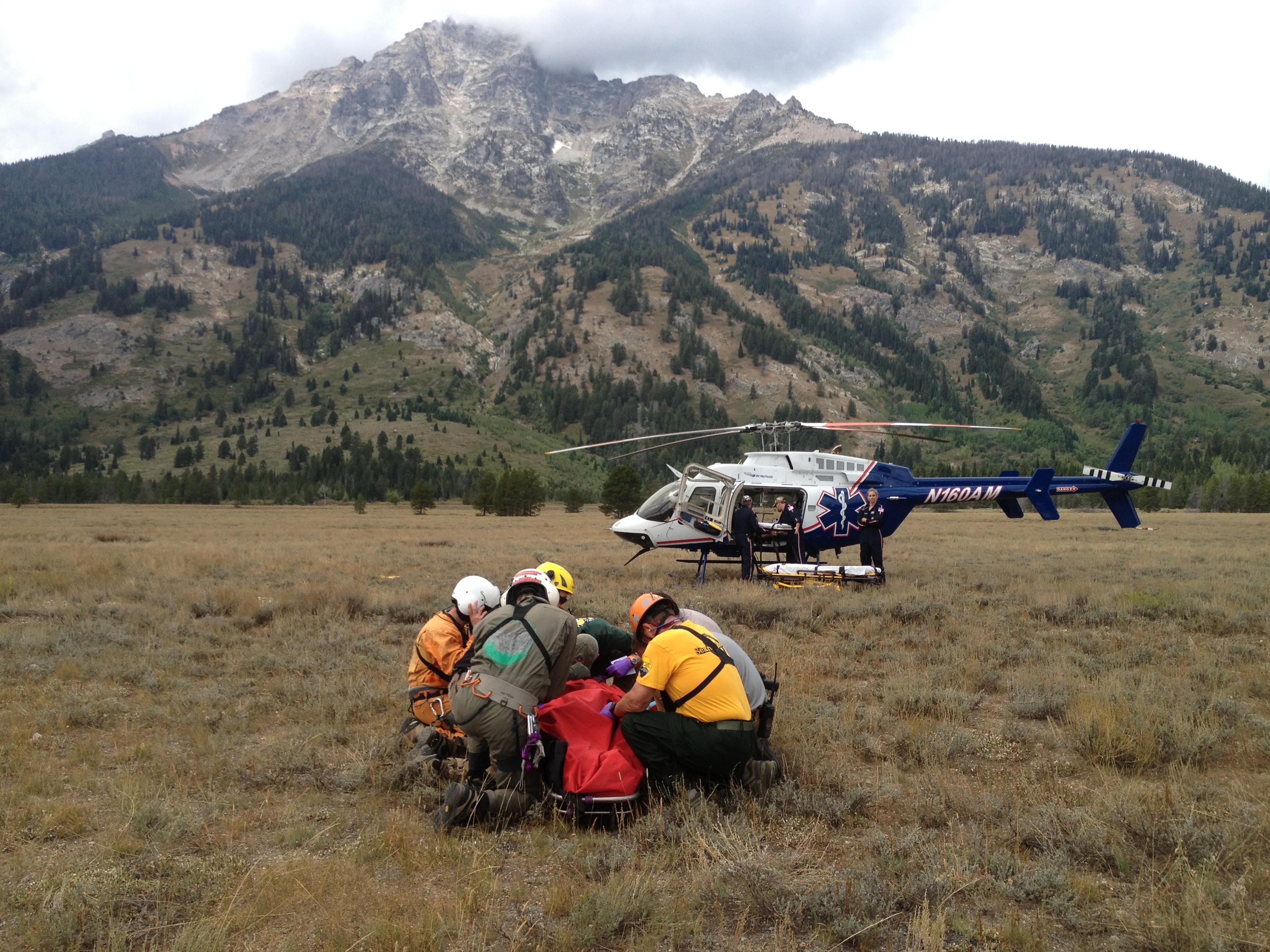Park Rangers attend to White before loading him into a lifeflight helicopter