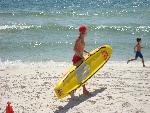 Lifeguard trains on rescue board