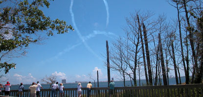 Visitors watch the Navy Blue Angels fly over the beach near Naval Live Oaks.