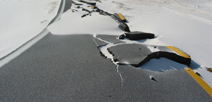 Holes in the black asphalt caused by overwash from hurricanes and tropical storms made the roads impassible by vehicle.