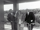 VIPs gaze up at the bells in the carillon