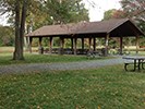Wooden pavilion with picnic tables